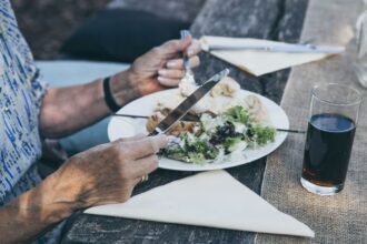 person holding kitchek knife