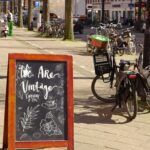 black city bike parked beside green bicycle during daytime