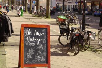 black city bike parked beside green bicycle during daytime