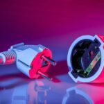 a close up of a red and white electrical device