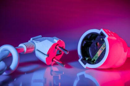 a close up of a red and white electrical device