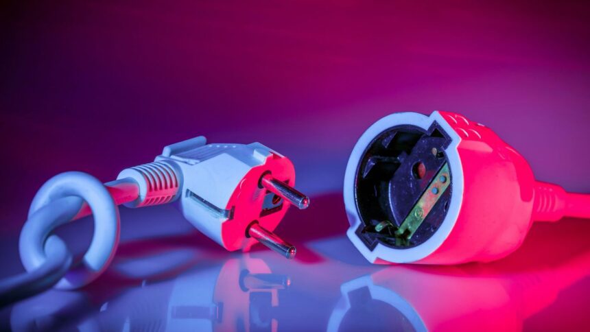 a close up of a red and white electrical device