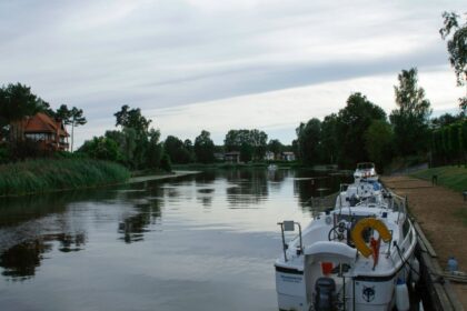 a boat is docked at a dock on the water