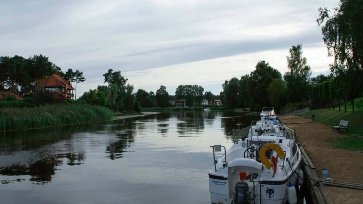 a boat is docked at a dock on the water